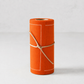 An orange roll of paper or fabric with white stitched border lines and tied with a natural jute string, set against a light gray background.