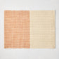 Orange and beige woven abaca and jute rectangular placemat with half and half pattern, 19"W x 14"L.