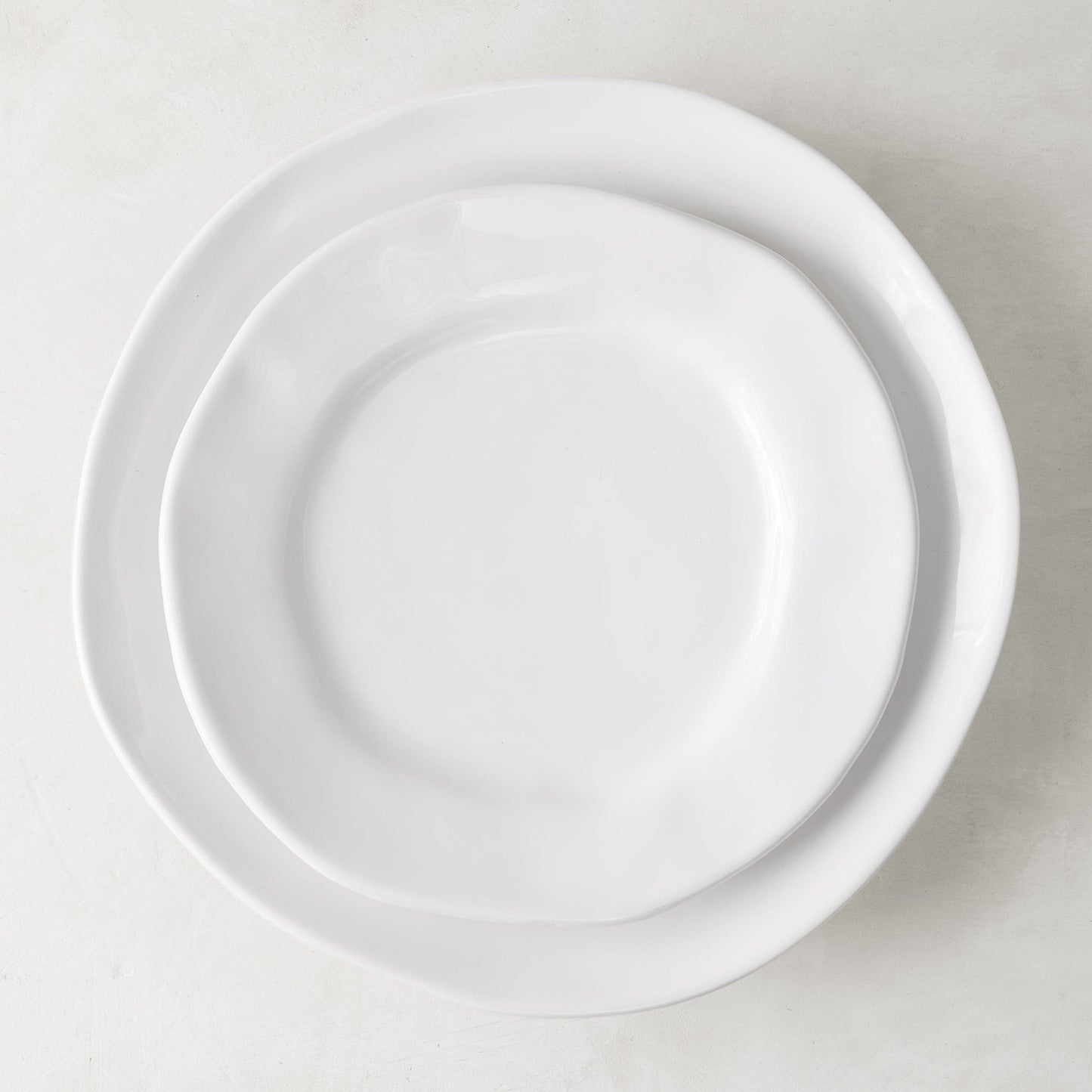 Organic Ceramic Dinner Plate, creamy white, 11.5" diameter, with subtle organic edges.