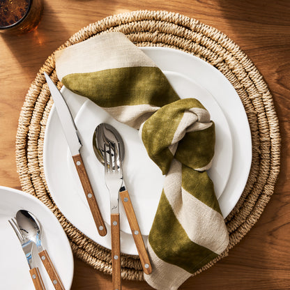 Organic Ceramic Dinner Plate, creamy white, 11.5" diameter, with subtle organic edges on a woven placemat.