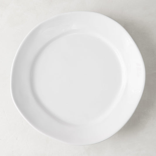 Organic Ceramic Dinner Plate, creamy white, 11.5" diameter, with subtle organic edges.