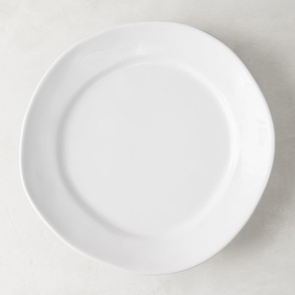 Organic Ceramic Dinner Plate, creamy white, 11.5" diameter, with subtle organic edges.