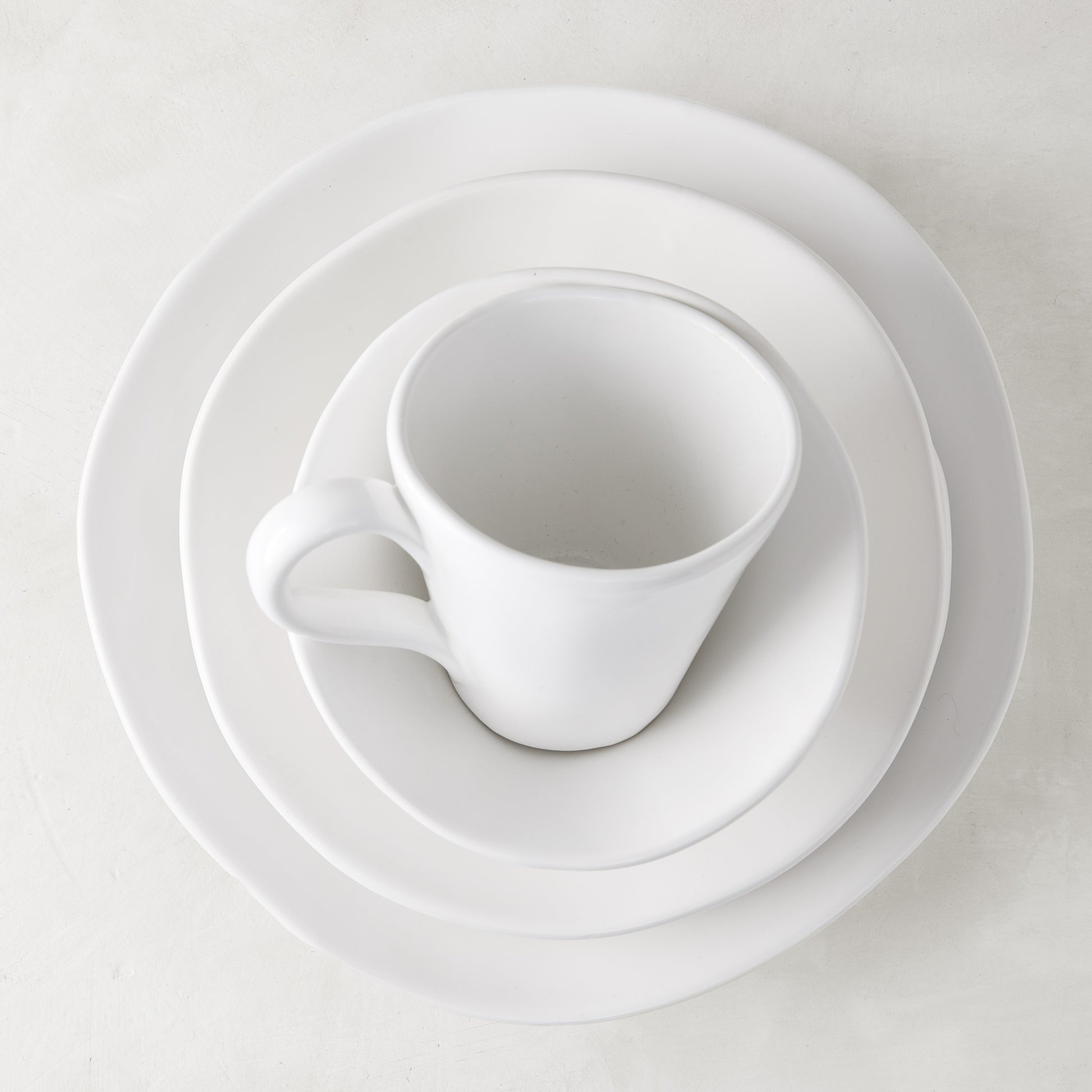 Organic Ceramic Collection low bowl, creamy white, 9" diameter, with subtle organic edges.