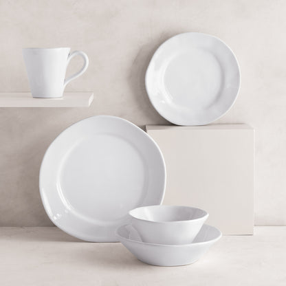 White ceramic Organic Low Bowl, dinner plate, salad plate, and mug with subtle organic edges.