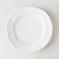 Creamy white ceramic salad plate with subtle organic edges, 9" diameter.