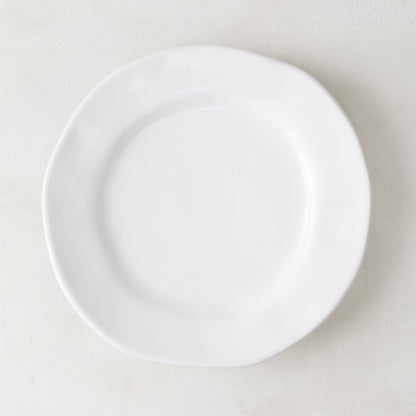 Creamy white ceramic salad plate with subtle organic edges, 9" diameter.
