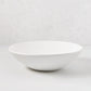 Organic Flared Ceramic Serve Bowl, creamy white, 12" diameter, subtle organic edges.
