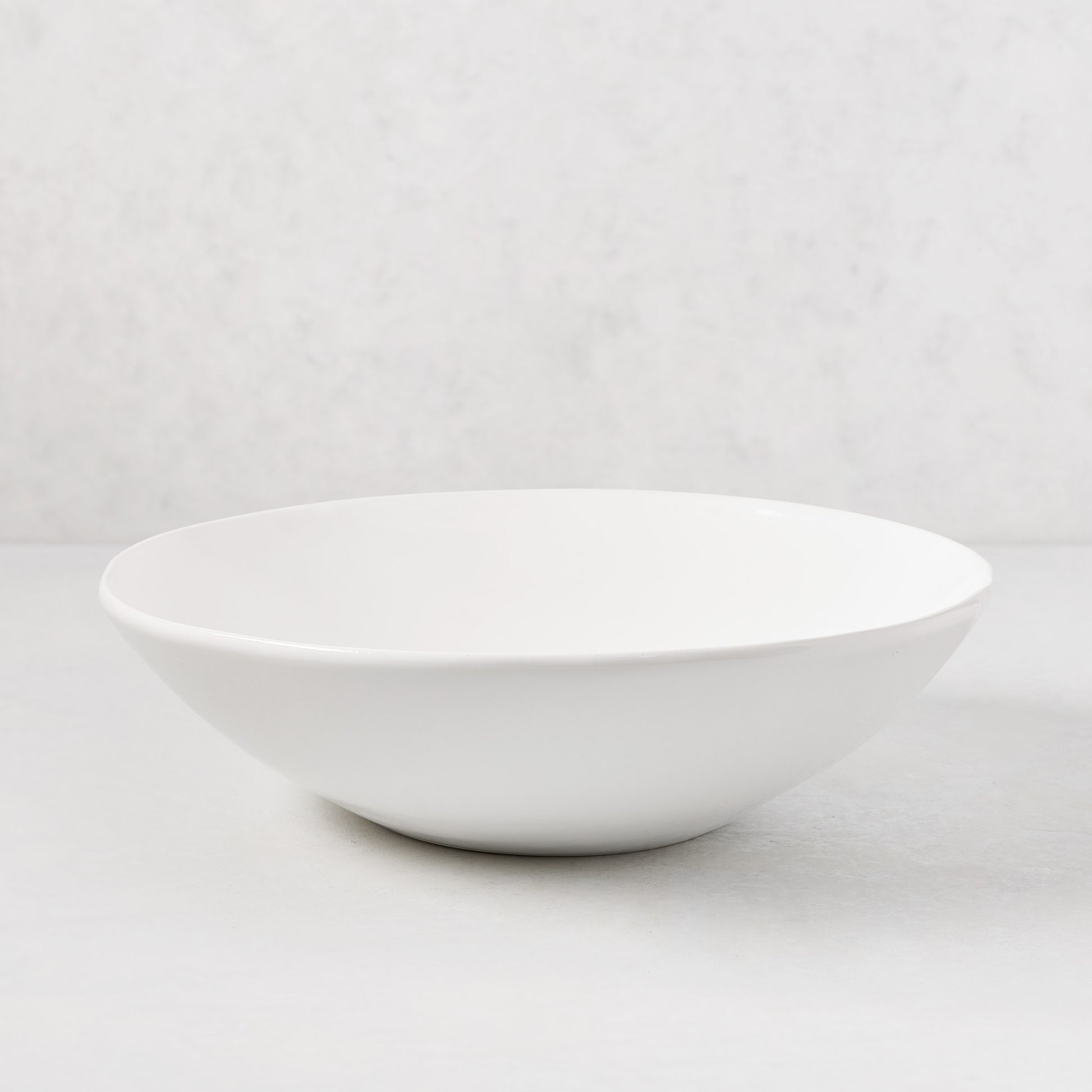 Organic Flared Ceramic Serve Bowl, creamy white, 12" diameter, subtle organic edges.