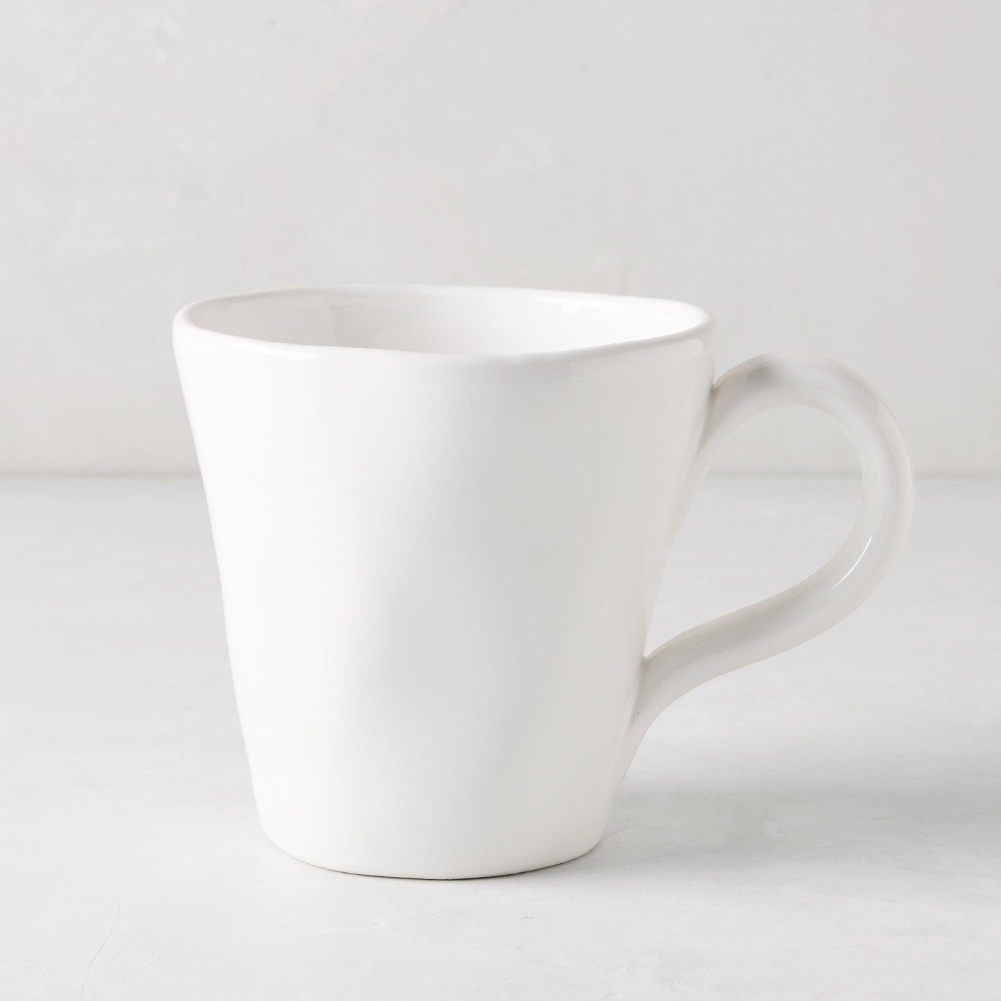 Organic White Ceramic Mug, 10 oz, with subtle organic edges and creamy white glaze.