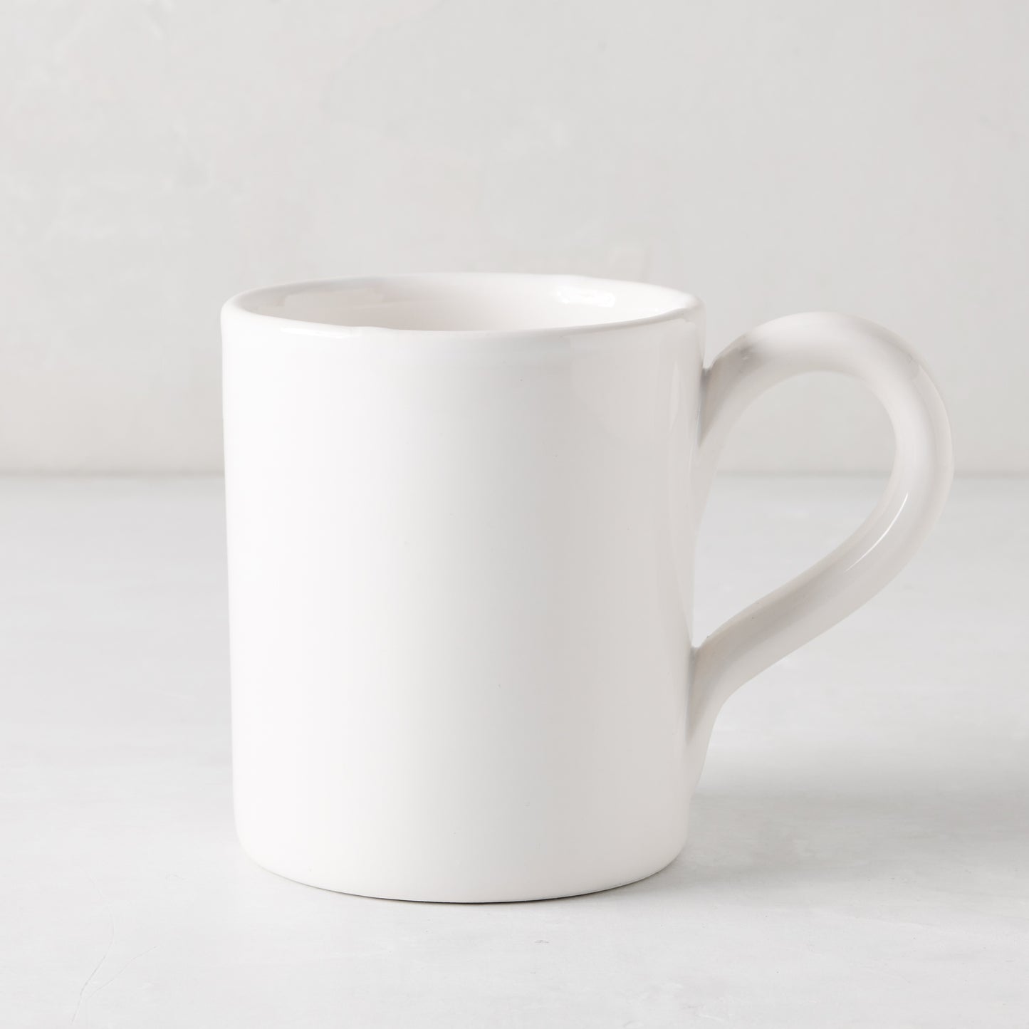 HG Original creamy white ceramic mug, 4" Diameter x 5"H, with clean edges and a generous handle.