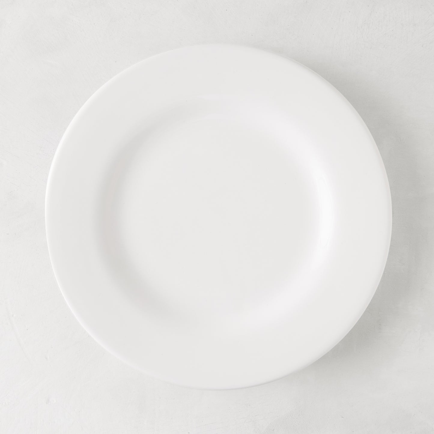 HG Original 10" creamy white ceramic salad plate with clean edges.