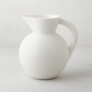 HG Original Large Round Ceramic Pitcher, creamy white, 9"W x 10"H, with a curved handle.