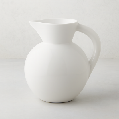 HG Original Large Round Ceramic Pitcher, creamy white, 9"W x 10"H, with a curved handle.