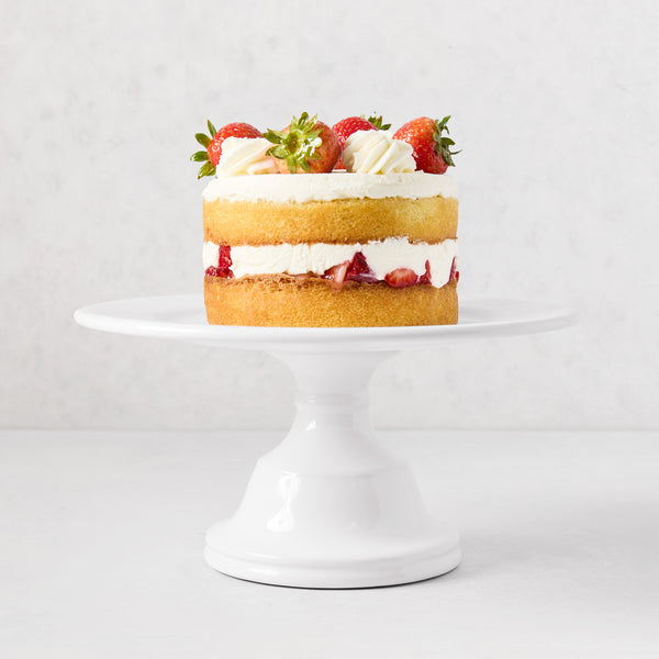 HG Original Small Pedestal Cake Stand, creamy white ceramic, 10.5" Dia, with strawberry cake.