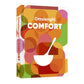 Hardcover cookbook, "Ottolenghi Comfort," with colorful abstract circles, white title, bowl, and spoon design.