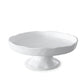White melamine cake stand with a sculptural, wavy edge, 12.75" diameter.
