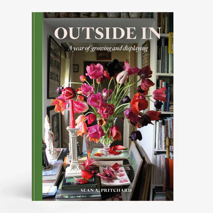 Hardcover book "Outside In" by Sean Pritchard with a green spine and a cover image of a vibrant floral arrangement.