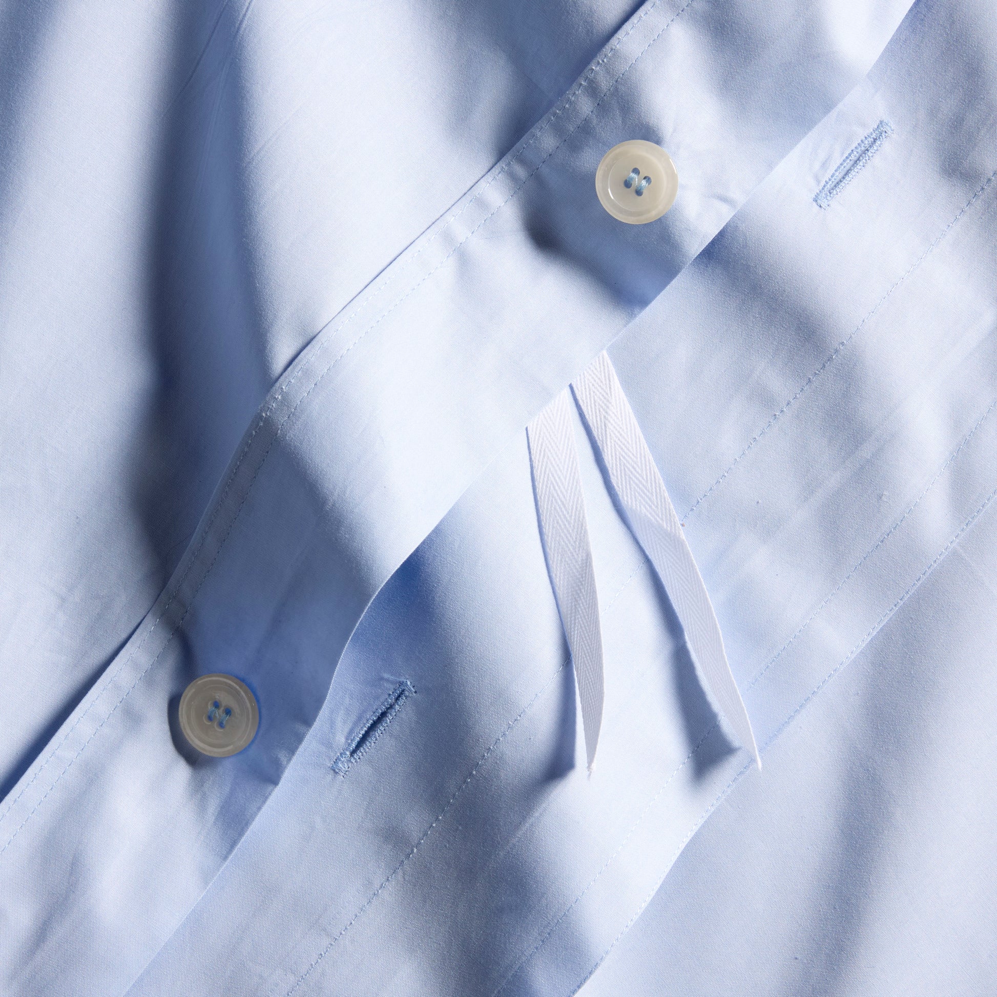 Oxford Blue Italian Percale Duvet Set with white buttons and interior ties.