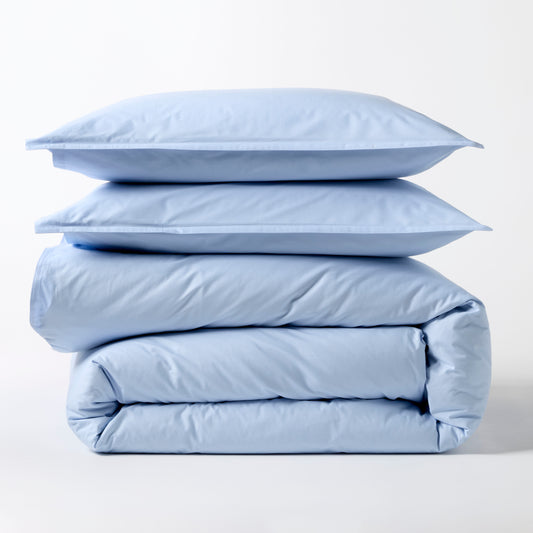 Oxford Blue Italian Percale Duvet Set: two shams stacked on a folded duvet cover.
