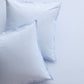 Set of two Oxford Blue Italian Percale Euro Shams with envelope closures, light blue cotton fabric.