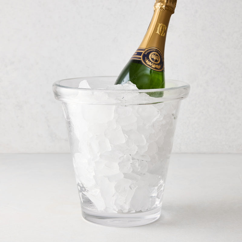 Clear Oxford Glass Ice Bucket with hand-molded rim, filled with ice and a green champagne bottle.