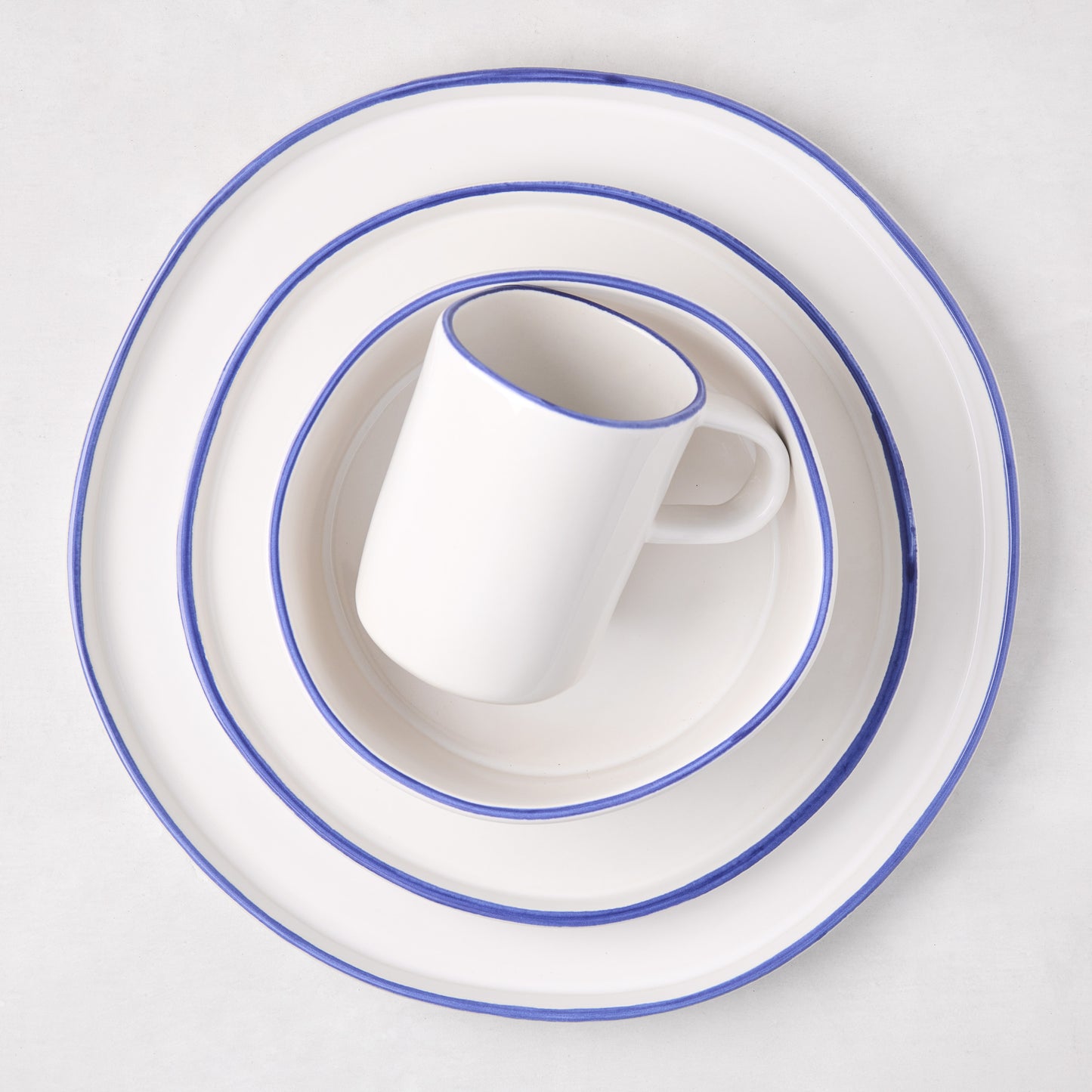 Pacific Blue-Rimmed Stoneware Dinner Plate, Salad Plate, and Mug set, 11" diameter.