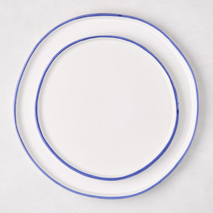 Pacific Blue-Rimmed Stoneware Dinner Plate, 11" diameter, with hand-painted blue edge and irregular shape.