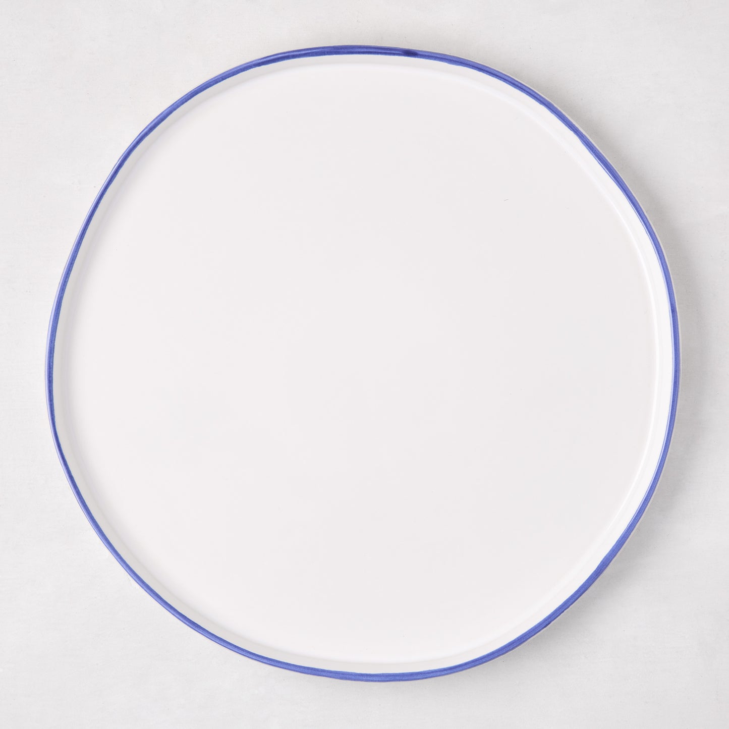 Pacific Blue-Rimmed Stoneware Dinner Plate, 11" diameter, with hand-painted irregular blue edge.
