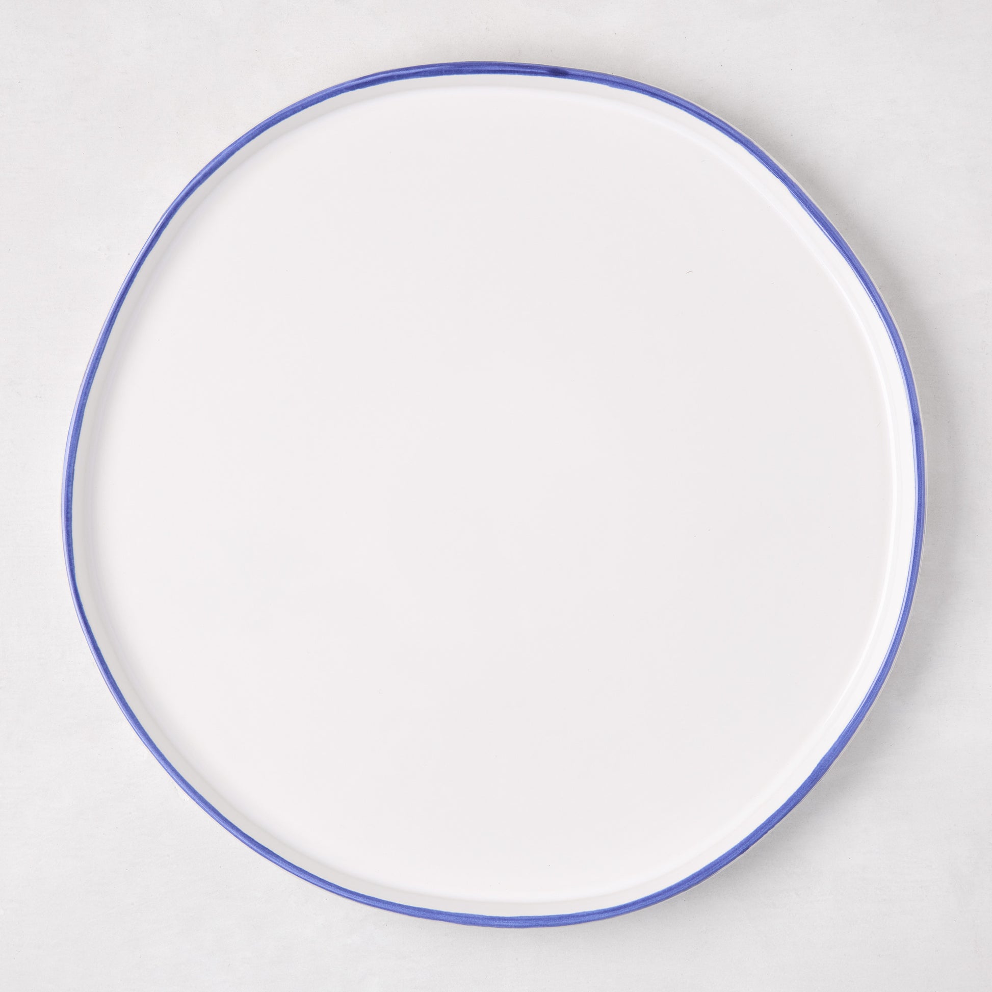 Pacific Blue-Rimmed Stoneware Dinner Plate, 11" diameter, with hand-painted irregular blue edge.