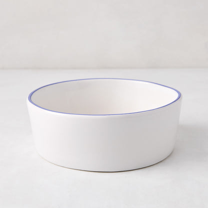 Pacific Blue-Rimmed Stoneware Soup Bowl, 6" diameter, white with hand-painted blue edge, irregular shape.
