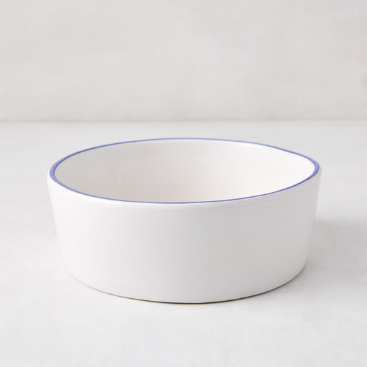 Pacific Blue-Rimmed Stoneware Soup Bowl, 6" diameter, white with hand-painted blue edge, irregular shape.