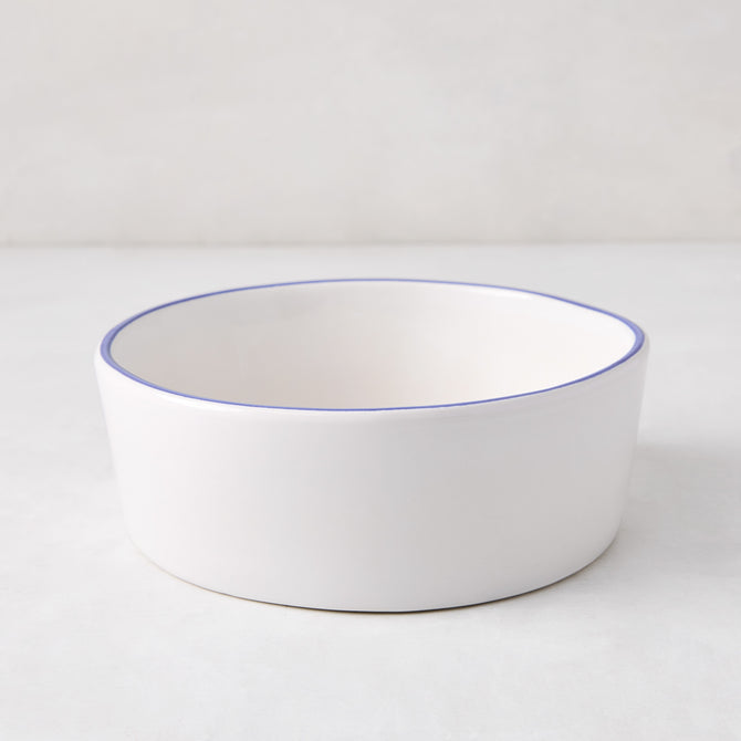 Pacific Blue-Rimmed Stoneware Soup Bowl, 6" diameter, white with hand-painted blue edge, irregular shape.