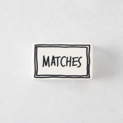 White porcelain match box with hand-painted black border and the word MATCHES in a whimsical font.