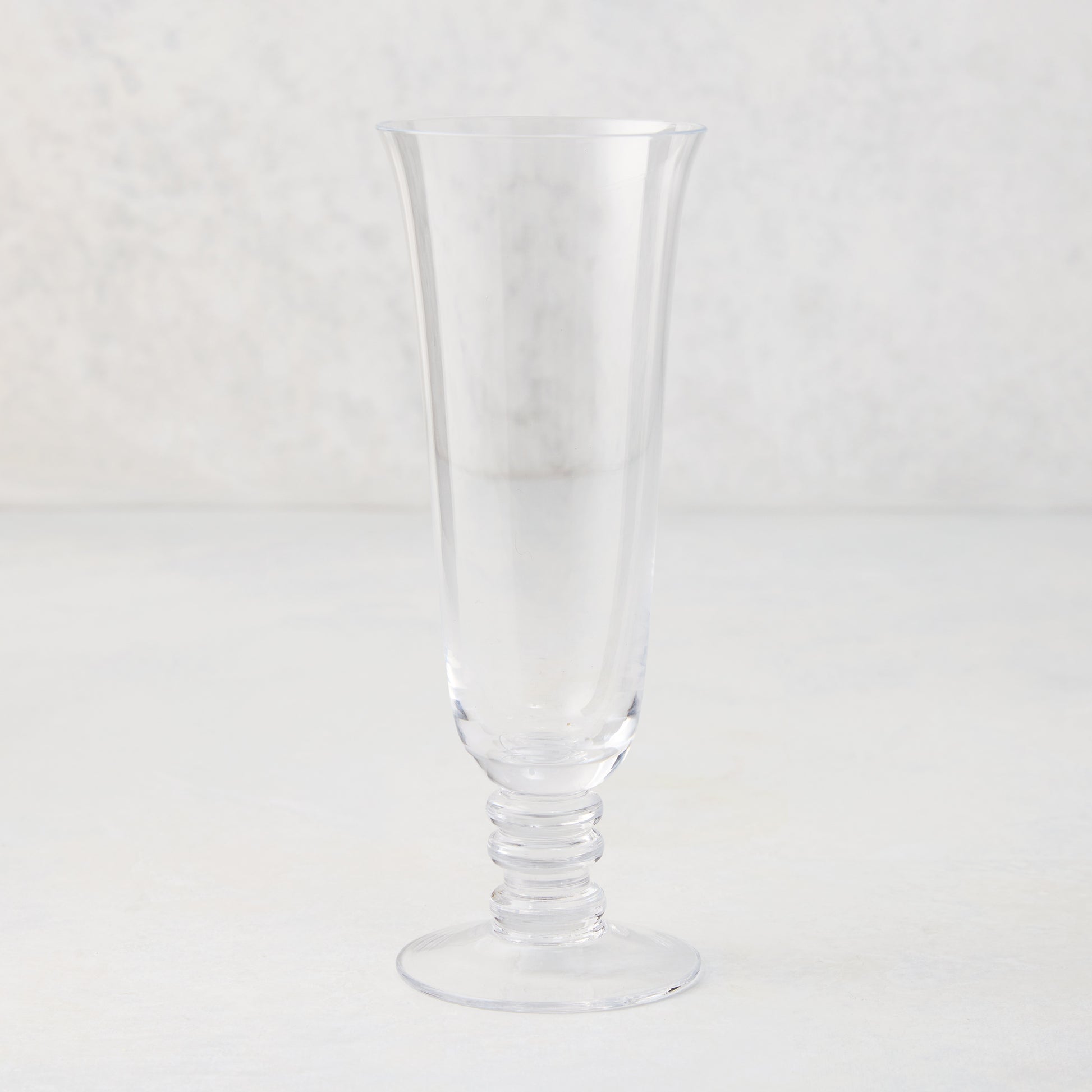 Palermo Stem Champagne Flute, clear hand-blown glass with curved lip and artistic ribbed stem.
