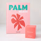Assouline Palm Beach hardcover book with pink cover next to a coral Hudson Grace scented candle box.