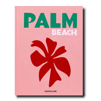 Palm Beach" hardcover book by Aerin Lauder, pink cover with green "PALM" and white "BEACH" text, red floral design.