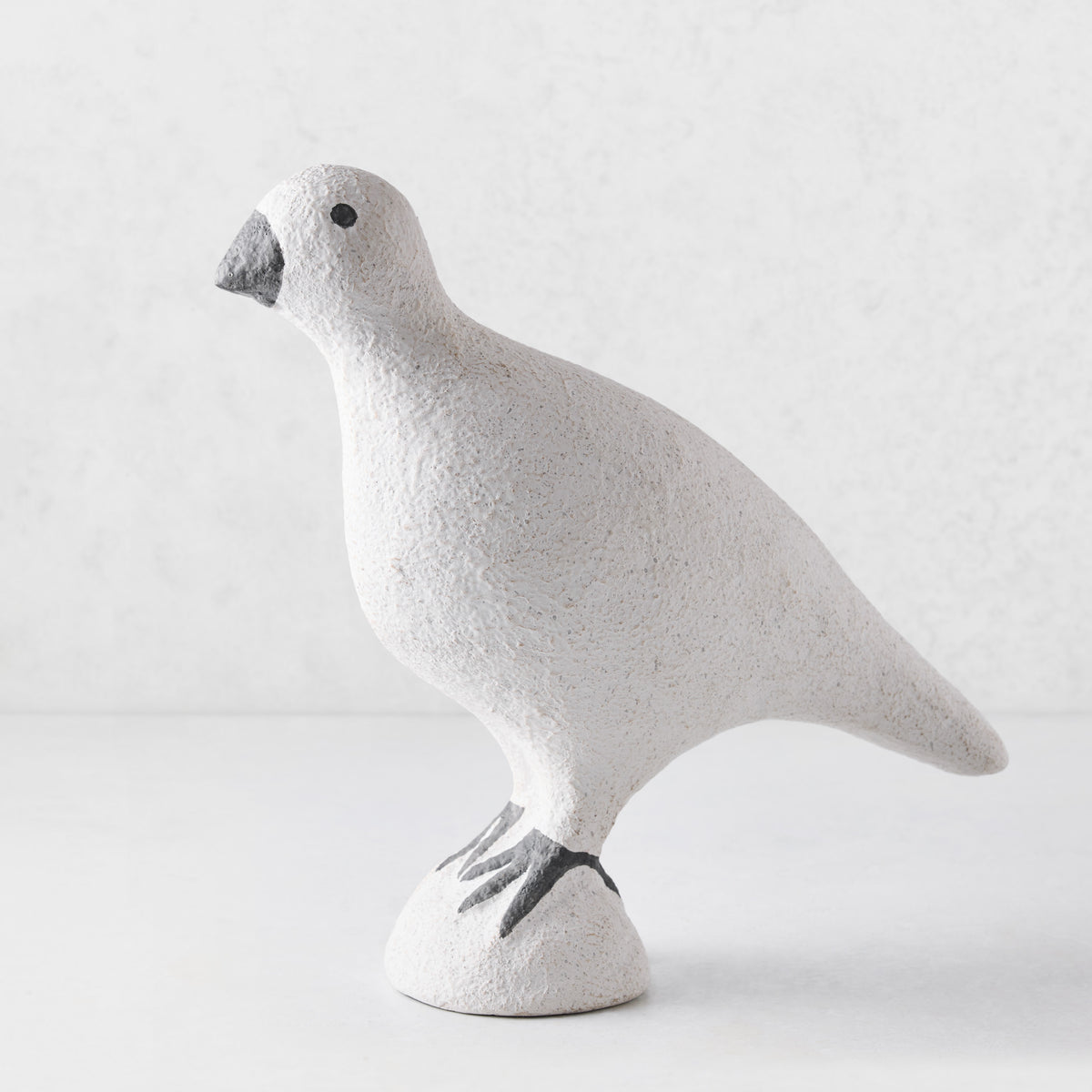 Handcrafted white paper mache turtledove figurine with a textured finish and dark grey beak and feet.