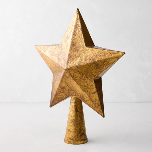 11-inch antique gold papier-mâché star tree topper with a textured, distressed finish on a conical base.