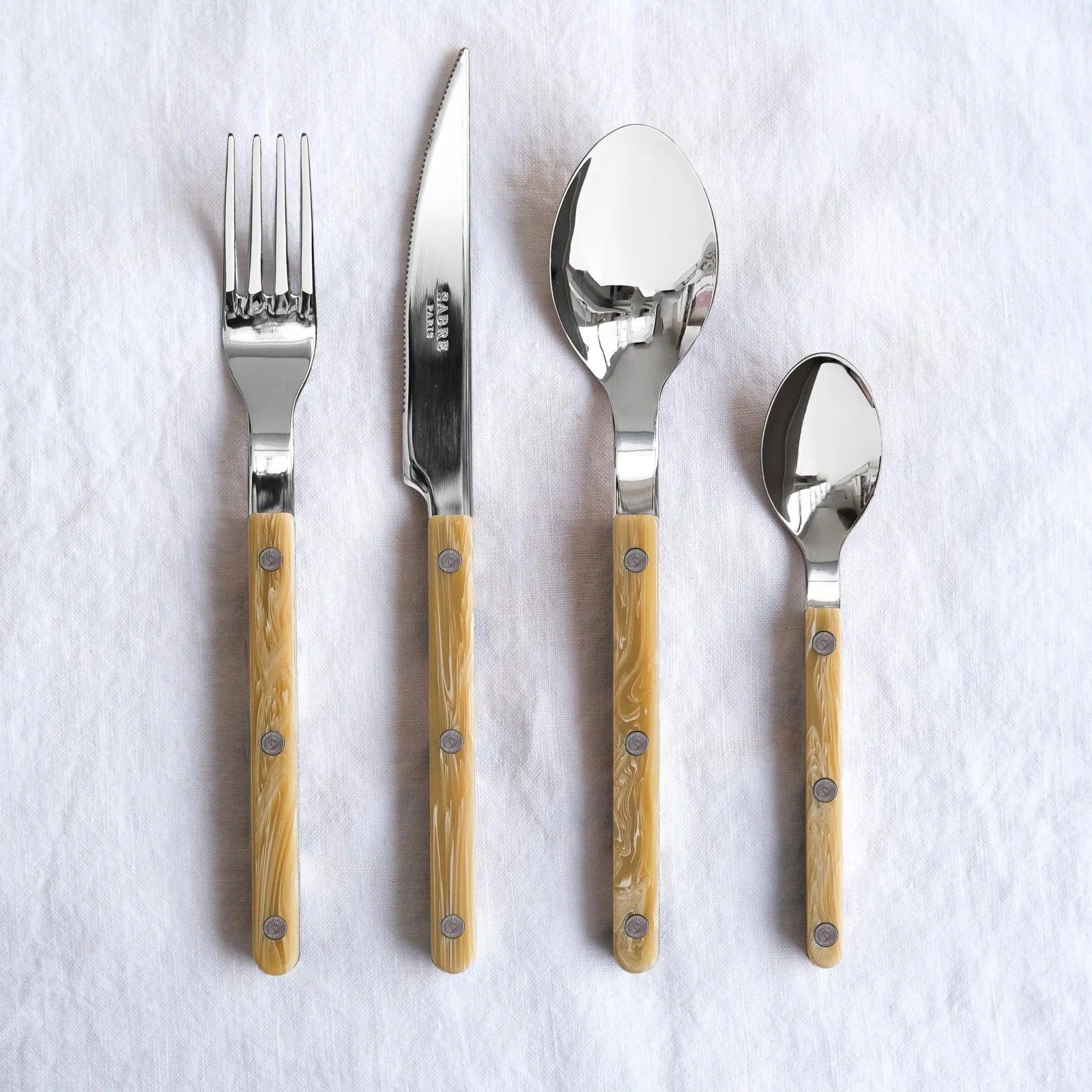 Paris Bistro 5-piece flatware set with 18/10 stainless steel and light brown acrylic handles.