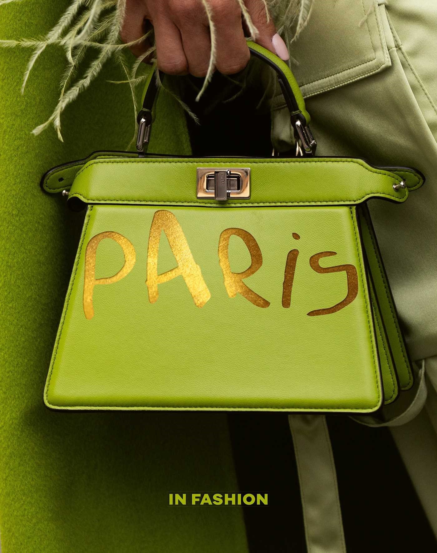 Lime green structured leather handbag with gold PARIS lettering and a metallic twist-lock closure.