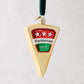 Hand-painted glass Parmesan cheese wedge Christmas ornament with glitter, red and green label, and velvet ribbon.