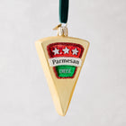 Hand-painted glass Parmesan cheese wedge Christmas ornament with glitter, red and green label, and velvet ribbon.