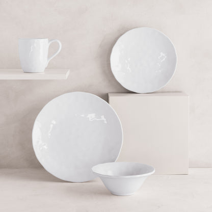 Pebble White ceramic mug, dinner plate, salad plate, and bowl with subtle textures.