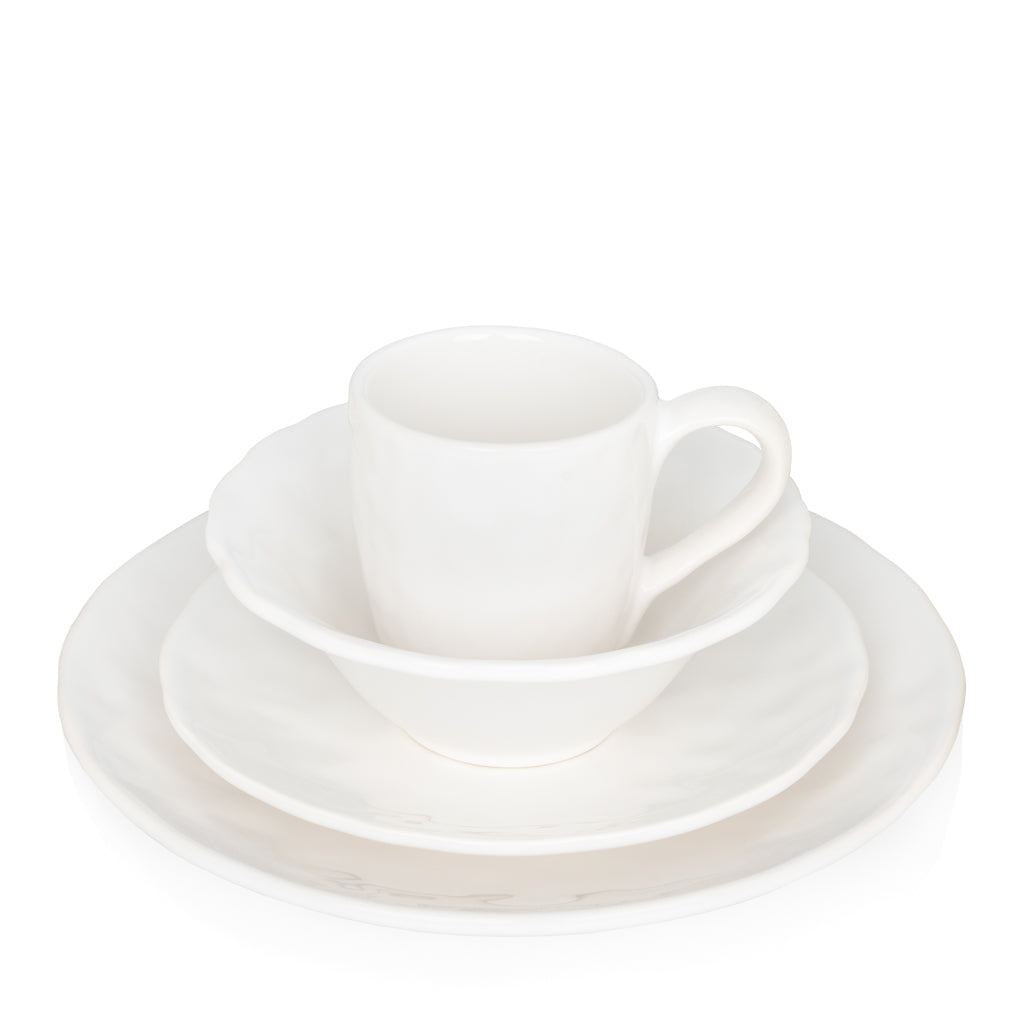 Pebble White ceramic mug, bowl, and plate set with subtle textures.