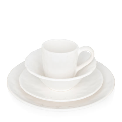 Pebble White ceramic mug, bowl, and plate set with subtle textures.