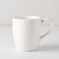 Pebble White ceramic mug with a creamy glaze and subtle textures, 10.14oz.