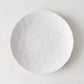 Pebble White ceramic salad plate, 8.5" diameter, with subtle textures and creamy white glaze.