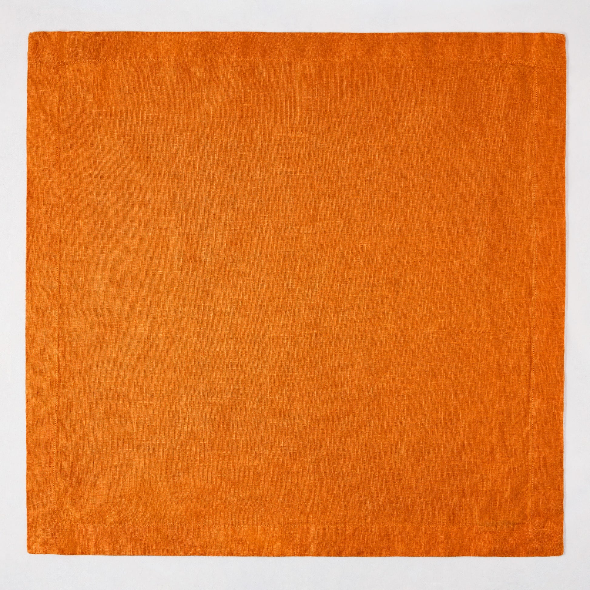 Persimmon HG Signature Hand-dyed Linen Napkin, 22" square, vibrant orange with mitered corners.