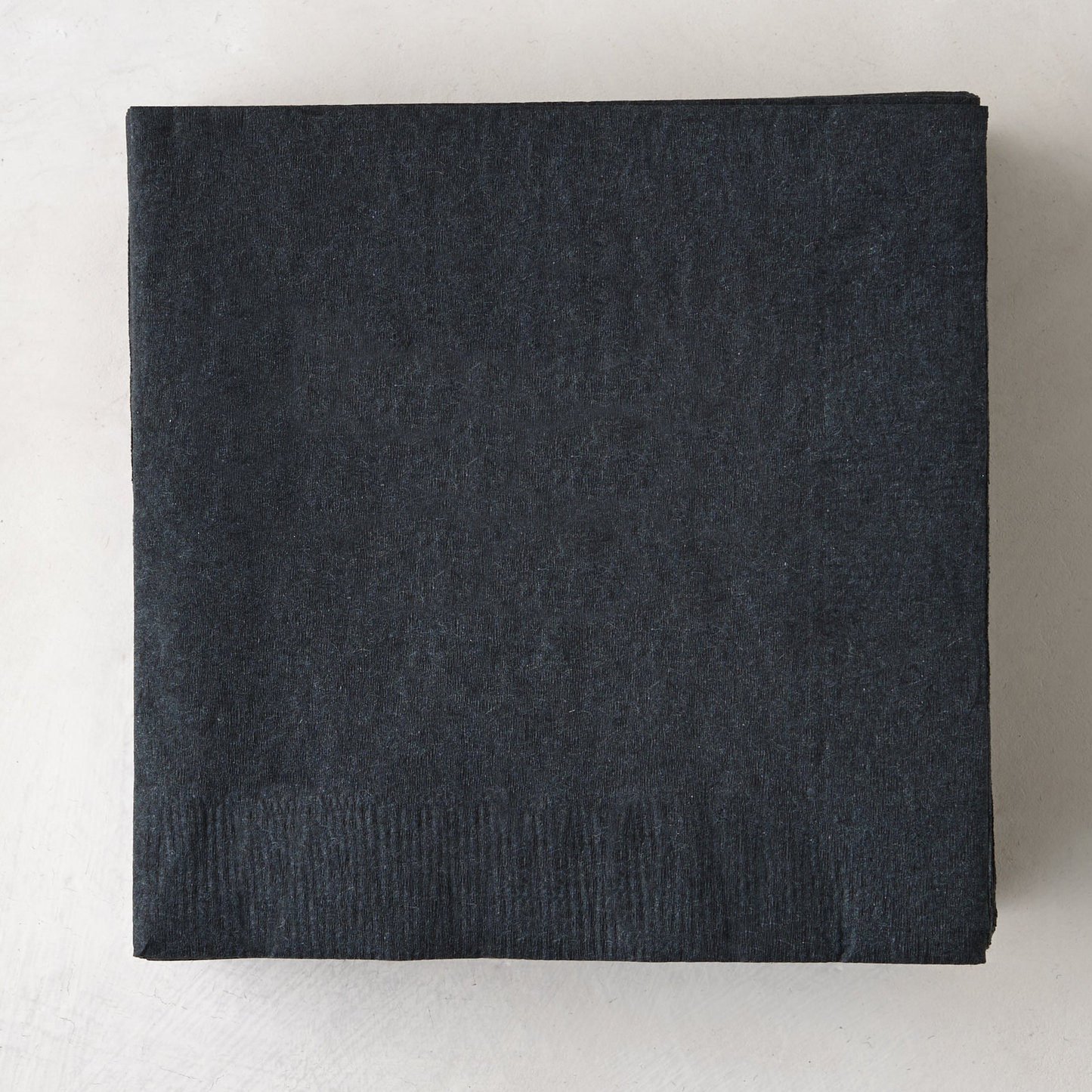 Stack of 50 personalized black 5.5" square 3-ply paper cocktail napkins.
