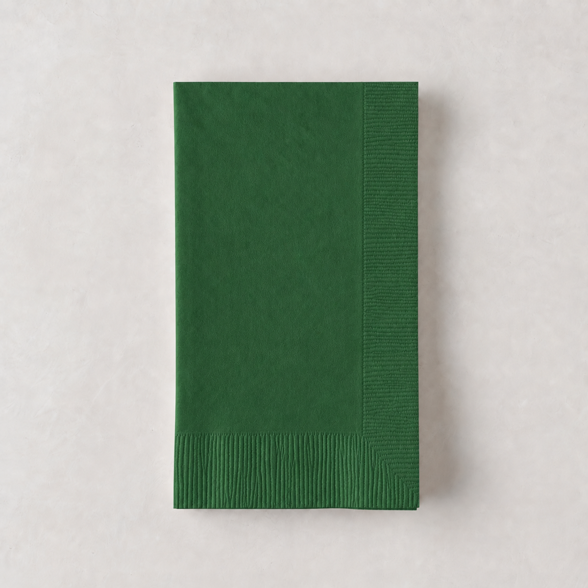 Dark green 3-ply disposable paper hand towel with a textured border, 8 by 4.5 inches.